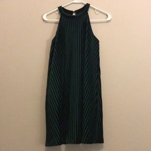 Emerald green flowy dress with ridges.